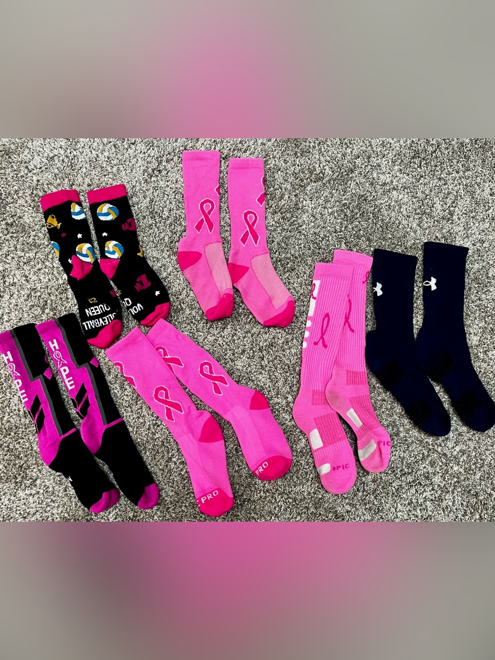 5 pairs of cancer awareness volleyball socks & 1 pair of navy blue Under Armors